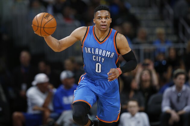 Oklahoma City Thunder guard Russell Westbrook picks up a loose ball and heads down the court against the Denver Nuggets during the first half of an NBA basketball game Tuesday, April 5, 2016, in Denver. (AP Photo/David Zalubowski)
