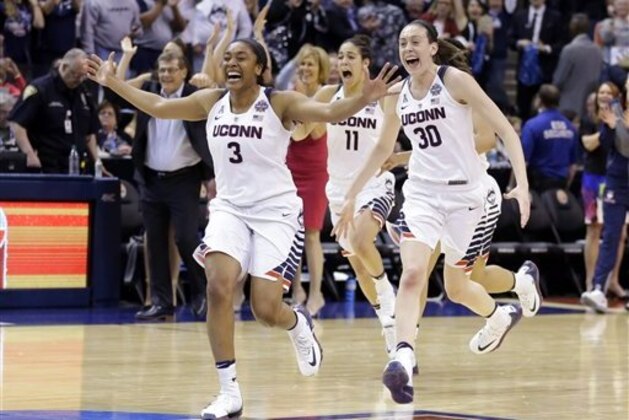 Connecticut's Morgan Tuck (3), Kia Nurse (11) and Breanna Stewart (30) celebrate after Connecticut's 82-51 victory over Syracuse in the championship game at the women's Final Four in the NCAA college basketball tournament Tuesday, April 5, 2016, in Indianapolis.(AP Photo/Michael Conroy)