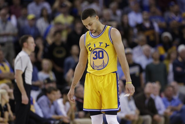 Golden State Warriors' Stephen Curry (30) looks down in the closing minutes of a 124-117 overtime loss to the Minnesota Timberwolves during an NBA basketball game Tuesday, April 5, 2016, in Oakland, Calif. (AP Photo/Marcio Jose Sanchez)