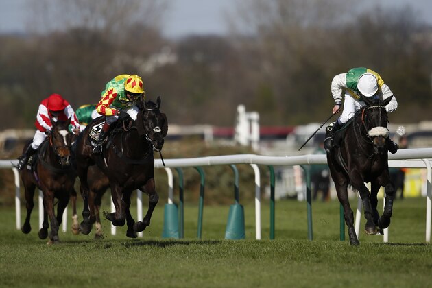 LIVERPOOL, ENGLAND - APRIL 11:  Leighton Aspell riding Many Clouds (R) win The Crabbie's Grand National Steeple Chase from Saint Are (C) on Crabbie's Grand National day at Aintree racecourse on April 11, 2015 in Liverpool, England. (Photo by Alan Crowhurst/Getty Images)