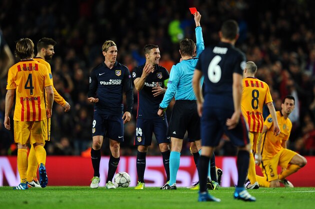 BARCELONA, SPAIN - APRIL 05:  Fernando Torres of Atletico Madrid (9) is shown a red card by referee Felix Brych and is sent off during the UEFA Champions League quarter final first leg match between FC Barcelona and Club Atletico de Madrid at Camp Nou on April 5, 2016 in Barcelona, Spain.  (Photo by David Ramos/Getty Images)
