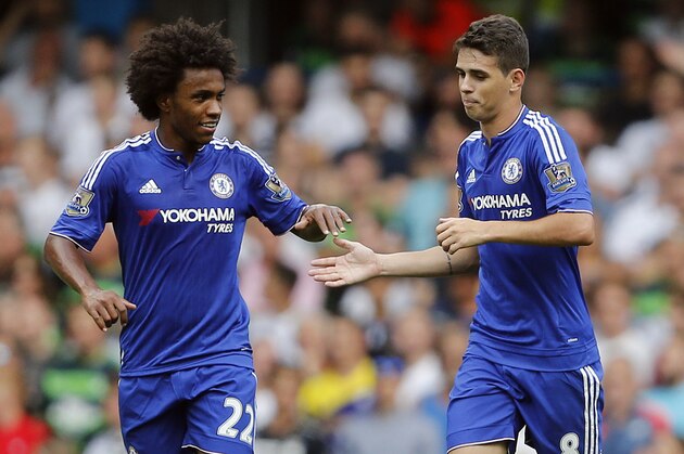 Chelsea's Willian, left, and Oscar celebrate after scoring  during the English Premier League soccer match between Chelsea and Swansea City at Stamford Bridge stadium in London, Saturday, Aug. 8, 2015.(AP Photo/Frank Augstein)