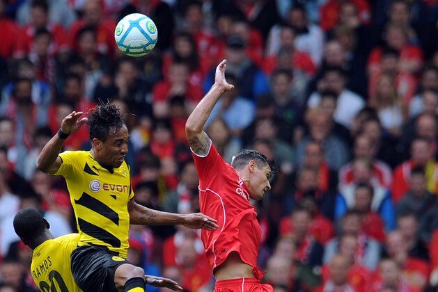 LIVERPOOL, ENGLAND - AUGUST 10:  Dejan Lovren (R) of Liverpool and Pierre Emerick Aubameyang (L) of Borussia Dortmund contest a header during the Pre Season Friendly match between Liverpool and Borussia Dortmund at Anfield on August 10, 2014 in Liverpool, England. (Photo by Clint Hughes/Getty Images)