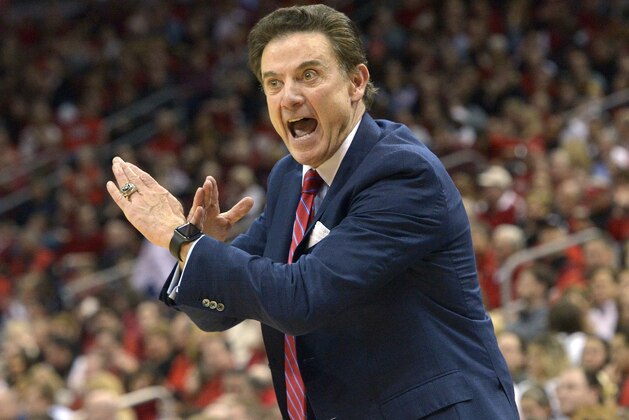 Louisville head coach Rick Pitino sends a play in to his team during the first half of an NCAA college basketball game against Syracuse, Wednesday, Feb. 17, 2016, in Louisville Ky. Louisville won 72-58. (AP Photo/Timothy D. Easley)