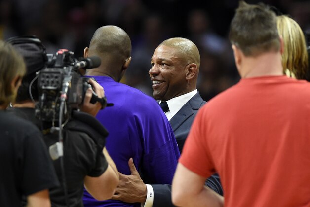 Apr 5, 2016; Los Angeles, CA, USA; Los Angeles Clippers head coach Doc Rivers embraces Los Angeles Lakers forward Kobe Bryant (24) after the game at Staples Center. The Clippers beat the Lakers 103-81. Mandatory Credit: Richard Mackson-USA TODAY Sports