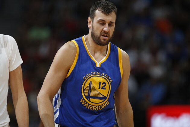 Golden State Warriors center Andrew Bogut (12) in the second half of an NBA basketball game Sunday, Nov. 22, 2015, in Denver. Golden State won 118-105. (AP Photo/David Zalubowski)