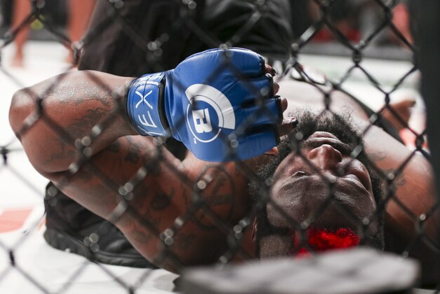 Feb 19, 2016; Houston, TX, USA; Dada 5000 (blue gloves) after a TKO during his Heavyweight fight against Kimbo Slice (not pictured) at Bellator 149 at Toyota Center. Mandatory Credit: Troy Taormina-USA TODAY Sports