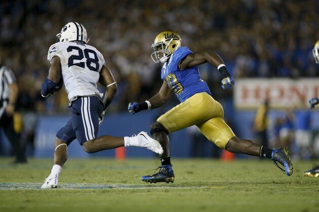 UCLA linebacker Myles Jack runs down BYU running back Adam Hine during an NCAA college football game, Saturday, Sept. 19, 2015, in Pasadena, Calif. UCLA won 24-23. (AP Photo/Danny Moloshok)