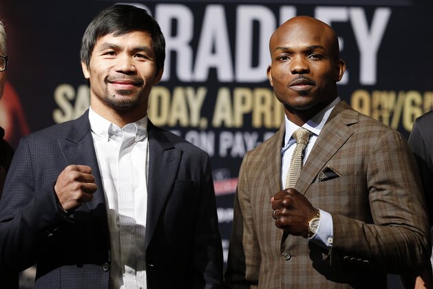 Manny Pacquiao, from the Philippines, left, poses with Timothy Bradley, Wednesday, April 6, 2016, in Las Vegas. The two are scheduled to fight in a welterweight title fight Saturday in Las Vegas. (AP Photo/John Locher)