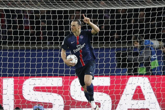 PSG's Zlatan Ibrahimovic collects the ball after scoring his side's first goal during the Champions League quarterfinal first leg soccer match between Paris St Germain and Manchester City at the Parc des Princes stadium in Paris, Wednesday, April 6, 2016. (AP Photo/Christophe Ena)