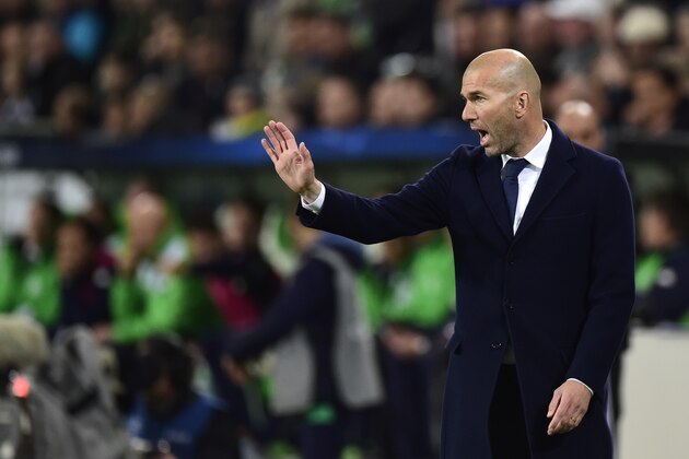 Real Madrid's French coach Zinedine Zidane reacts during the UEFA Champions League quarter-final, first-leg football match between VfL Wolfsburg and Real Madrid on April 6, 2016 in Wolfsburg, northern Germany.  / AFP / John MACDOUGALL        (Photo credit should read JOHN MACDOUGALL/AFP/Getty Images)
