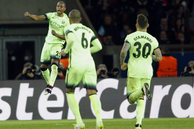 Manchester City's Fernandinho, right, jumps in the air as he celebrates his side's 2nd goal during the Champions League quarterfinal first leg soccer match between Paris St Germain and Manchester City at the Parc des Princes stadium in Paris, Wednesday, April 6, 2016. (AP Photo/Christophe Ena)