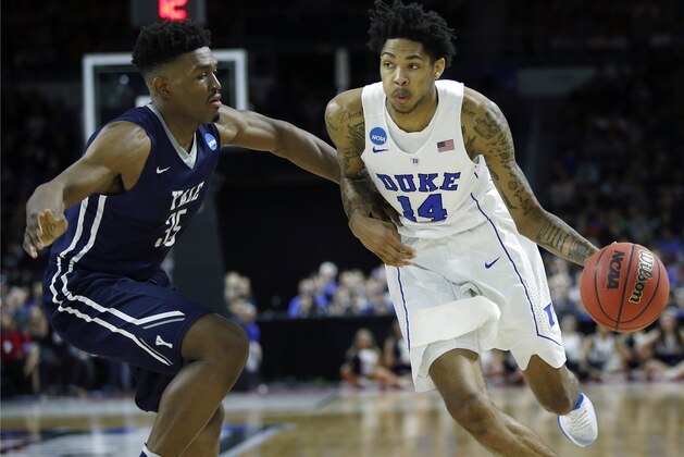Duke's Brandon Ingram (14) drives past Yale's Brandon Sherrod (35) during the second half in the second round of the NCAA men's college basketball tournament in Providence, R.I., Saturday, March 19, 2016. Duke won 71-64. (AP Photo/Michael Dwyer)