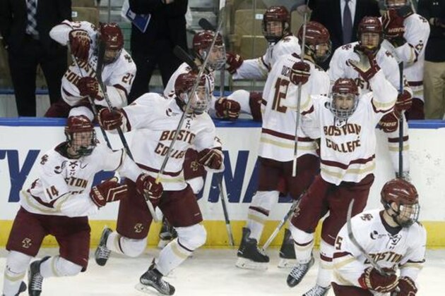 Boston College players celebrate after defeating Minnesota-Duluth 3-2 in the NCAA men's northeast regional championship hockey game in Worcester, Mass., Saturday, March 26, 2016. (AP Photo/Michael Dwyer)