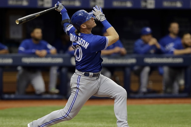 Toronto Blue Jays' Josh Donaldson watches his three-run home run off Tampa Bay Rays starting pitcher Matt Moore during the third inning of a baseball game Wednesday, April 6, 2016, in St. Petersburg, Fla.  (AP Photo/Chris O'Meara)