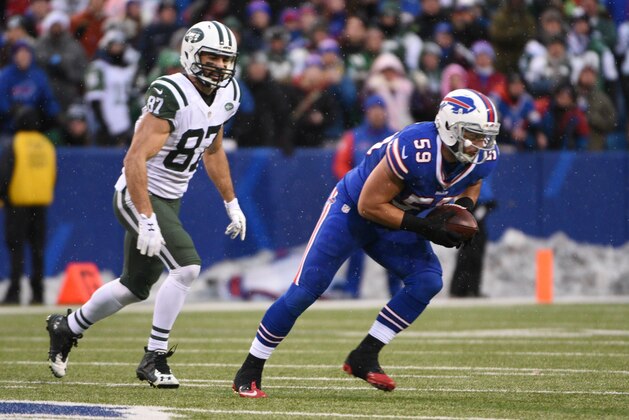 New York Jets wide receiver Eric Decker (87) chases Buffalo Bills' A.J. Tarpley (59) after Tarpley intercepted a pass to end the game during the second half of an NFL football game Sunday, Jan. 3, 2016, in Orchard Park, N.Y. The Bills won 22-17. (AP Photo/Gary Wiepert)