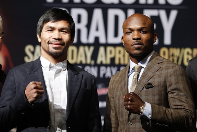 Manny Pacquiao, from the Philippines, left, poses with Timothy Bradley, Wednesday, April 6, 2016, in Las Vegas. The two are scheduled to fight in a welterweight title fight Saturday in Las Vegas. (AP Photo/John Locher)