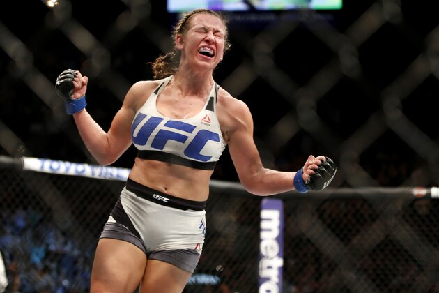 Miesha Tate celebrates victory over Holly Holm in their UFC 196 women’s bantamweight mixed martial arts match Saturday, March 5, 2016, in Las Vegas. (AP Photo/Eric Jamison)