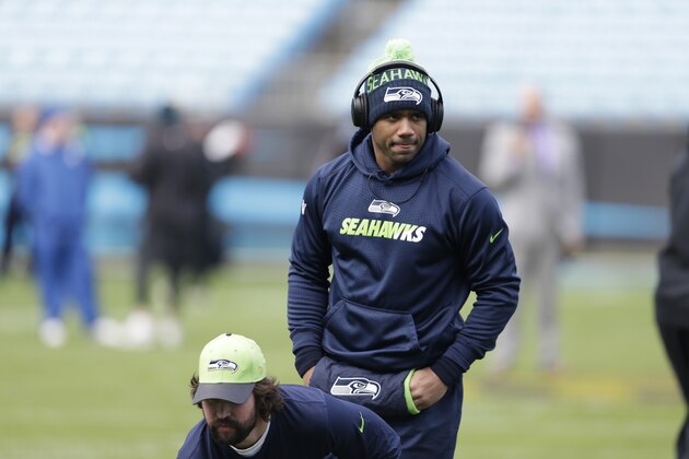 Seattle Seahawks quarterback Russell Wilson warms up before the first half of an NFL divisional playoff football game between the Carolina Panthers and the Seattle Seahawks, Sunday, Jan. 17, 2016, in Charlotte, N.C. (AP Photo/Bob Leverone)