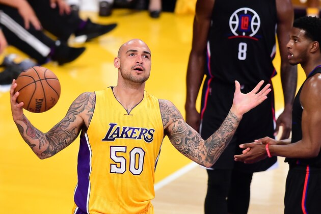 Robert Sacre of the Los Angeles Lakers reacts to a missed opportunity against the Los Angeles Clippers score during their NBA game on April 6, 2016 at Staples Center in Los Angeles, California. / AFP / FREDERIC J. BROWN        (Photo credit should read FREDERIC J. BROWN/AFP/Getty Images)