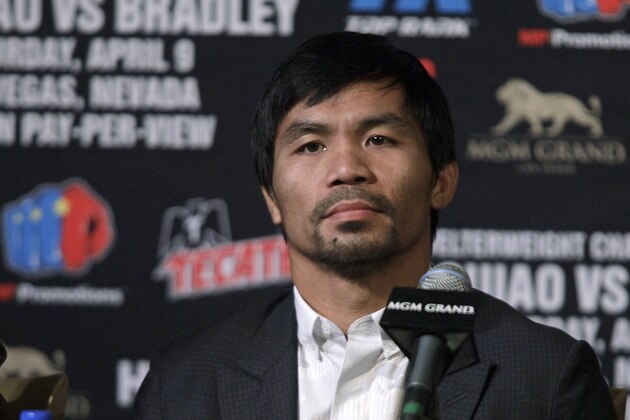 Welterweight boxer Manny Pacquiao listens as Timothy Bradley Jr. speaks during their final news conference at the MGM Grand Hotel & Casino Wednesday April 6, 2016 in Las Vegas, Nevada.
Pacquiao and Timothy Bradley Jr., will meet for their third fight on April 9 at the MGM Grand Garden Arena in Las Vegas. / AFP / John GURZINSKI (Photo credit should read JOHN GURZINSKI/AFP/Getty Images) Welterweight boxer Manny Pacquiao listens as Timothy Bradley Jr. speaks during their final news conference at the MGM Grand Hotel & Casino Wednesday April 6, 2016 in Las Vegas, Nevada.
Pacquiao and Timothy Bradley Jr., will meet for their third fight on April 9 at the MGM Grand Garden Arena in Las Vegas. / AFP / John GURZINSKI (Photo credit should read JOHN GURZINSKI/AFP/Getty Images)