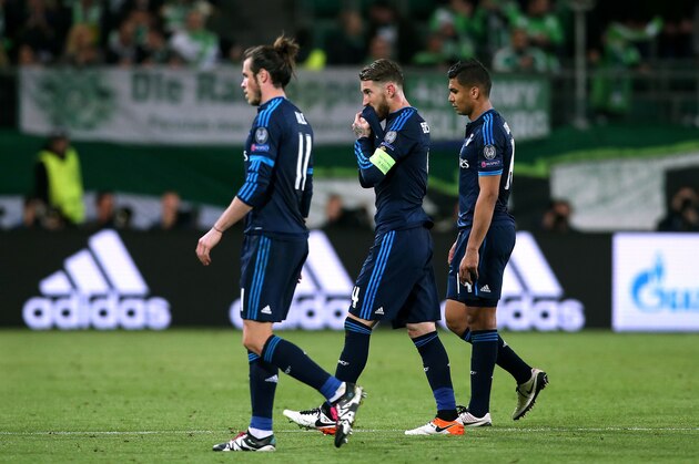L-R) Real Madrid's Welsh forward Gareth Bale Real Madrid's defender Sergio Ramos and Real Madrid's Brazilian midfielder Casemiro react after the UEFA Champions League quarter-final, first-leg football match between VfL Wolfsburg and Real Madrid on April 6, 2016 in Wolfsburg, northern Germany. 
Wolfsburg won the match 2-0. / AFP / RONNY HARTMANN        (Photo credit should read RONNY HARTMANN/AFP/Getty Images)