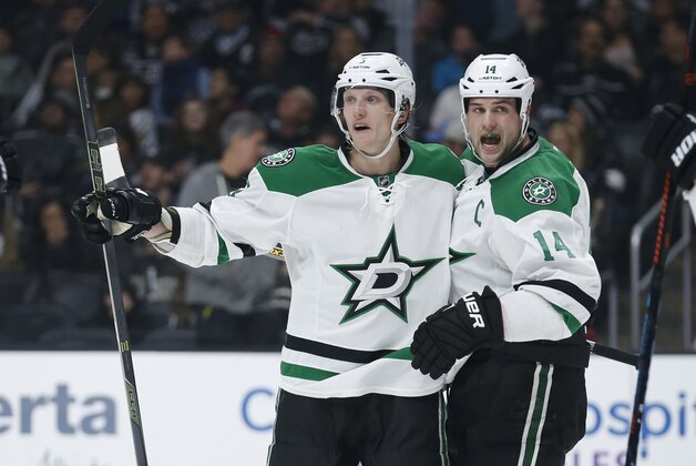 Dallas Stars left wing Jamie Benn, right, celebrates his power play goal with Dallas Stars defenseman John Klingberg, left, during the first period of an NHL hockey game against the Los Angeles Kings, Saturday, April 2, 2016, in Los Angeles. (AP Photo/Danny Moloshok)