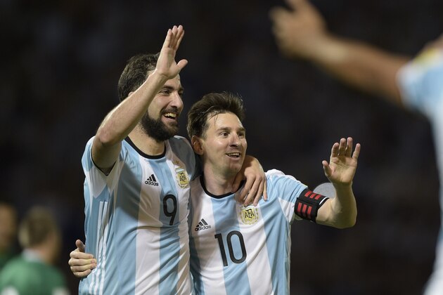 Argentina's Gonzalo Higuain (L) and Lionel Messi celebrate after teammate Gabriel Mercado scored against Bolivia during their Russia 2018 FIFA World Cup South American Qualifiers' football match in Cordoba, Argentina, on March 29, 2016.   AFP PHOTO / JUAN MABROMATA / AFP / JUAN MABROMATA        (Photo credit should read JUAN MABROMATA/AFP/Getty Images)
