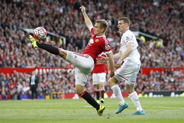 Manchester United's Luke Shaw controls the ball during the English Premier League soccer match between Manchester United and Liverpool at Old Trafford Stadium, Manchester, England, Saturday, Sept. 12, 2015. (AP Photo/Jon Super)