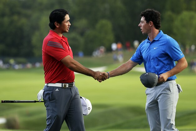 Jason Day, of Australia, left, and Rory McIlroy, of Northern Ireland, shake hands on the 18th green following the third round of the PGA Championship golf tournament at Valhalla Golf Club on Saturday, Aug. 9, 2014, in Louisville, Ky. (AP Photo/Jeff Roberson)