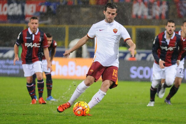 Roma's Miralem Pjanic scores on a penalty kick during a Serie A soccer match between Bologna and Roma, at the Bologna Dall'Ara stadium, Italy, Saturday, Nov. 21, 2015. (AP Photo/Gianfilippo Oggioni)