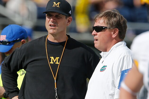Jan 1, 2016; Orlando, FL, USA; Florida Gators head coach Jim McElwain (right) and Michigan Wolverines head coach Jim Harbaugh meet at mid field in the 2016 Citrus Bowl at Orlando Citrus Bowl Stadium. Mandatory Credit: Reinhold Matay-USA TODAY Sports