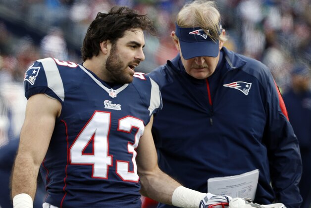 New England Patriots defensive back Nate Ebner (43) talks with special teams coach Scott O'Brien in the bench area during the second half of an NFL football game Sunday, Dec. 28, 2014, in Foxborough, Mass. (AP Photo/Elise Amendola)
