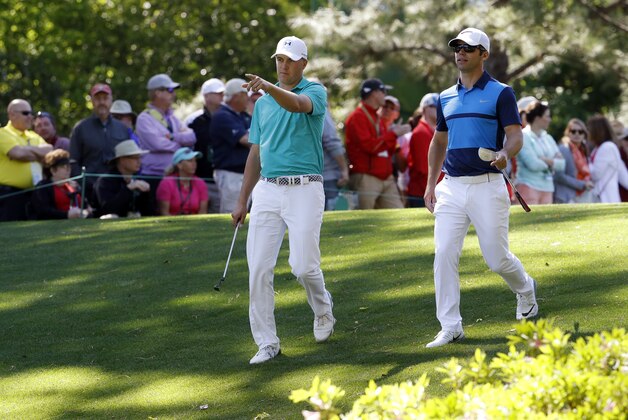 Jordan Spieth, left, and Paul Casey, of England, walk down the sixth fairway during the first round of the Masters golf tournament Thursday, April 7, 2016, in Augusta, Ga. (AP Photo/Charlie Riedel)