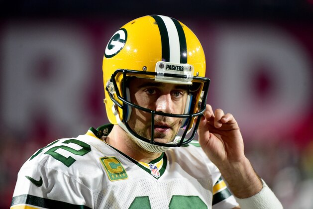 GLENDALE, AZ - JANUARY 16:  Quarterback Aaron Rodgers #12 of the Green Bay Packers looks on before taking on the Arizona Cardinals in the NFC Divisional Playoff Game at University of Phoenix Stadium on January 16, 2016 in Glendale, Arizona.  (Photo by Harry How/Getty Images)