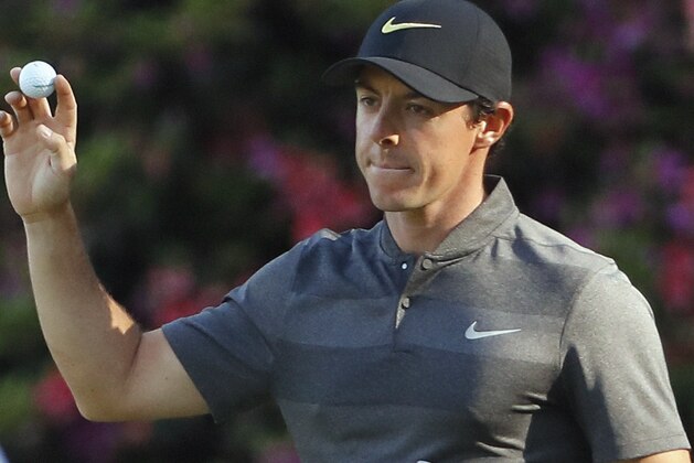 Rory McIlroy, of Northern Ireland, holds up his ball after an eagle on the 13th hole during the first round of the Masters golf tournament Thursday, April 7, 2016, in Augusta, Ga. (AP Photo/David J. Phillip)