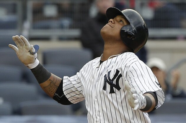 New York Yankees' Starlin Castro reacts as he crosses the plate after hitting a solo home run against the Houston Astros during the fourth inning of a baseball game, Thursday, April 7, 2016, in New York. (AP Photo/Julie Jacobson)