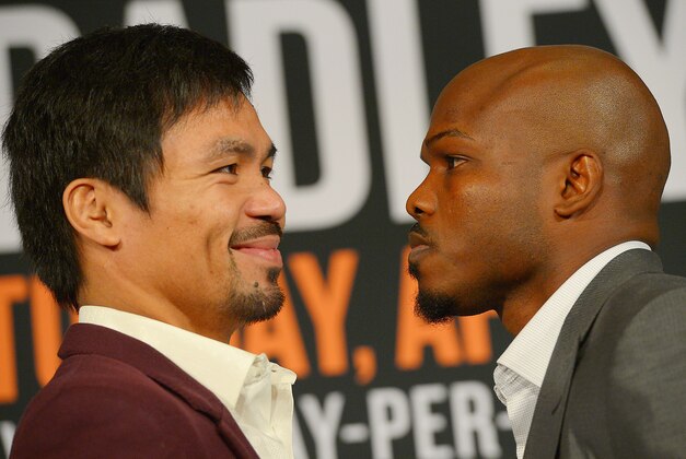 Jan 19, 2016; Beverly Hills, CA, USA; Manny Pacquiao and Timothy Bradley, Jr face off during a press conference at the Beverly Hills Hotel to announce their upcoming boxing fight. Mandatory Credit: Jayne Kamin-Oncea-USA TODAY Sports