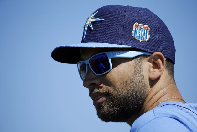 Tampa Bay Rays' James Loney stands on a field during a spring training baseball workout in Port Charlotte, Fla., Friday, Feb. 26, 2016. (AP Photo/Patrick Semansky)