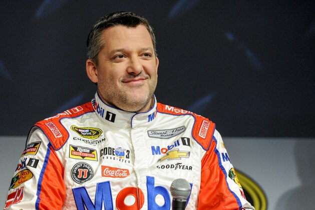Stewart Haas Racing co-owner and driver Tony Stewart talks to members of the media during the NASCAR Charlotte Motor Speedway Media Tour in Charlotte, N.C., Thursday, Jan. 21, 2016. (AP Photo/Mike McCarn)