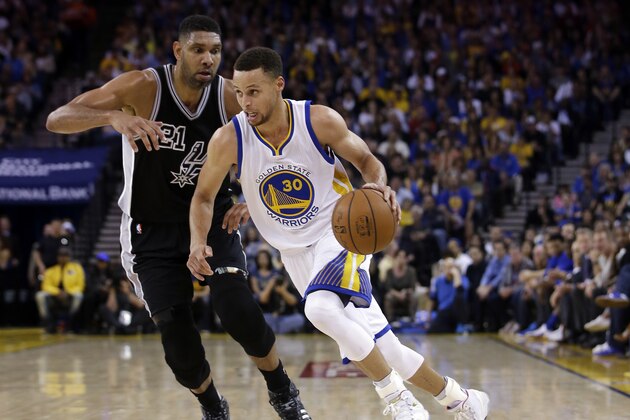 Golden State Warriors' Stephen Curry (30) dribbles past San Antonio Spurs' Tim Duncan during the first half of an NBA basketball game Thursday, April 7, 2016, in Oakland, Calif. (AP Photo/Marcio Jose Sanchez)