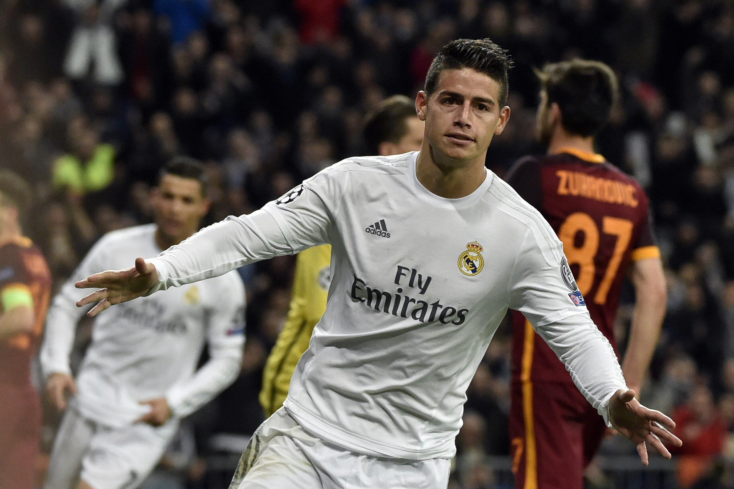 TOPSHOT - Real Madrid's Colombian midfielder James Rodriguez celebrates after scoring  during the UEFA Champions League round of 16, second leg football match Real Madrid FC vs AS Roma at the Santiago Bernabeu stadium in Madrid on March 8, 2016. / AFP / GERARD JULIEN        (Photo credit should read GERARD JULIEN/AFP/Getty Images)