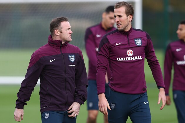 England captain Wayne Rooney (L) talks with striker Harry Kane (R) during a team training session at Tottenham Hotspur Training Centre in London on November 16, 2015, ahead of their friendly football match against France at Wembley Stadium on November 17, 2015. AFP PHOTO / JUSTIN TALLIS

NOT FOR MARKETING OR ADVERTISING USE / RESTRICTED TO EDITORIAL USE        (Photo credit should read JUSTIN TALLIS/AFP/Getty Images)