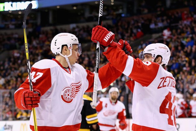 BOSTON, MASSACHUSETTS - APRIL 07:  Henrik Zetterberg #40 of the Detroit Red Wings congratulates Alexei Marchenko #47 after he scored against the Boston Bruins during the second period at TD Garden on April 7, 2016 in Boston, Massachusetts.  (Photo by Maddie Meyer/Getty Images)