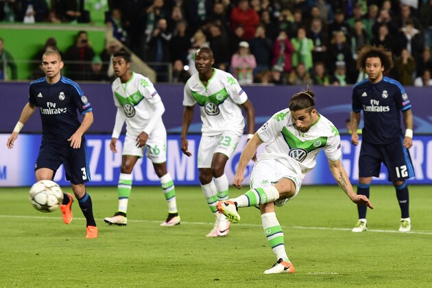 Wolfsburg's Swiss defender Ricardo Rodriguez scores a penalty kick during the UEFA Champions League quarter-final, first-leg football match between VfL Wolfsburg and Real Madrid on April 6, 2016 in Wolfsburg, northern Germany.  / AFP / John MACDOUGALL        (Photo credit should read JOHN MACDOUGALL/AFP/Getty Images)
