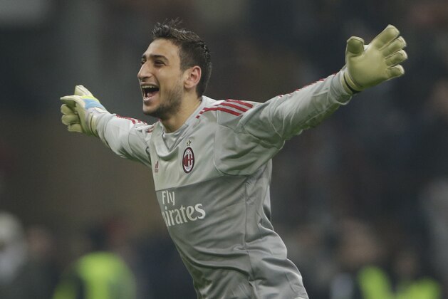 AC Milan goalkeeper Gianluigi Donnarumma celebrates at the end of a  Serie A soccer match between AC Milan and Inter Milan, at the San Siro stadium in Milan, Italy, Sunday, Jan. 31, 2016.  Milan won 3-0. (AP Photo/Luca Bruno)