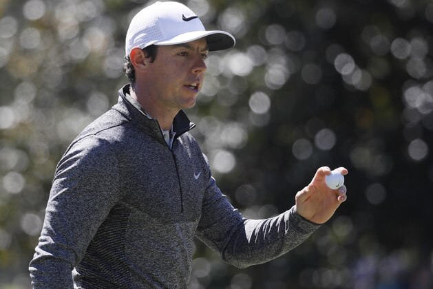 Rory McIlroy, of Northern Ireland, holds up his ball after saving par on the first hole during the second round of the Masters golf tournament Friday, April 8, 2016, in Augusta, Ga. (AP Photo/Chris Carlson)