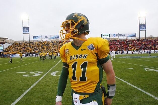 North Dakota State quarterback Carson Wentz (11) leaves the field during the FCS championship NCAA college football game between North Dakota State and Jacksonville State, Saturday, Jan. 9, 2016, in Frisco, Texas.  North Dakota State beat Jacksonville State 37-10 to win their fifth consecutive championship.  (AP Photo/Mike Stone)