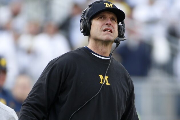 Michigan head coach Jim Harbaugh stands on the sidelines during an NCAA college football game against Penn State in State College, Pa., Saturday, Nov. 21, 2015. (AP Photo/Gene J. Puskar)