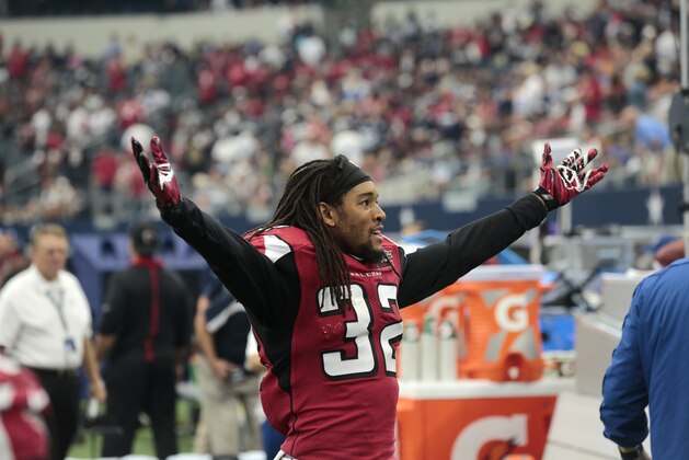 Atlanta Falcons' Jalen Collins (32) celebrates on the sideline during an NFL football game against the Dallas Cowboys Sunday, Sept. 27, 2015, in Arlington, Texas. (AP Photo/Michael Ainsworth)